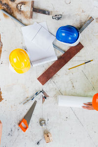 High angle view of work tools on table at workshop