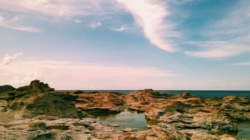 Scenic view of sea against cloudy sky