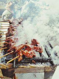 Close-up of meat on barbecue grill