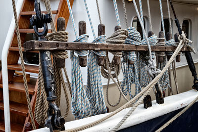 Rope tied to boat moored at harbor