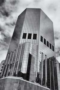 Low angle view of building against cloudy sky