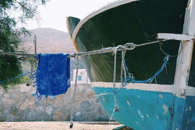 Close-up of metal chain hanging from boat