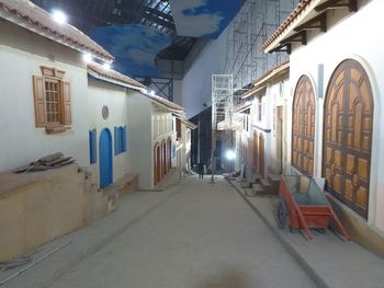 Empty alley amidst buildings in city