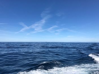 Scenic view of sea against blue sky