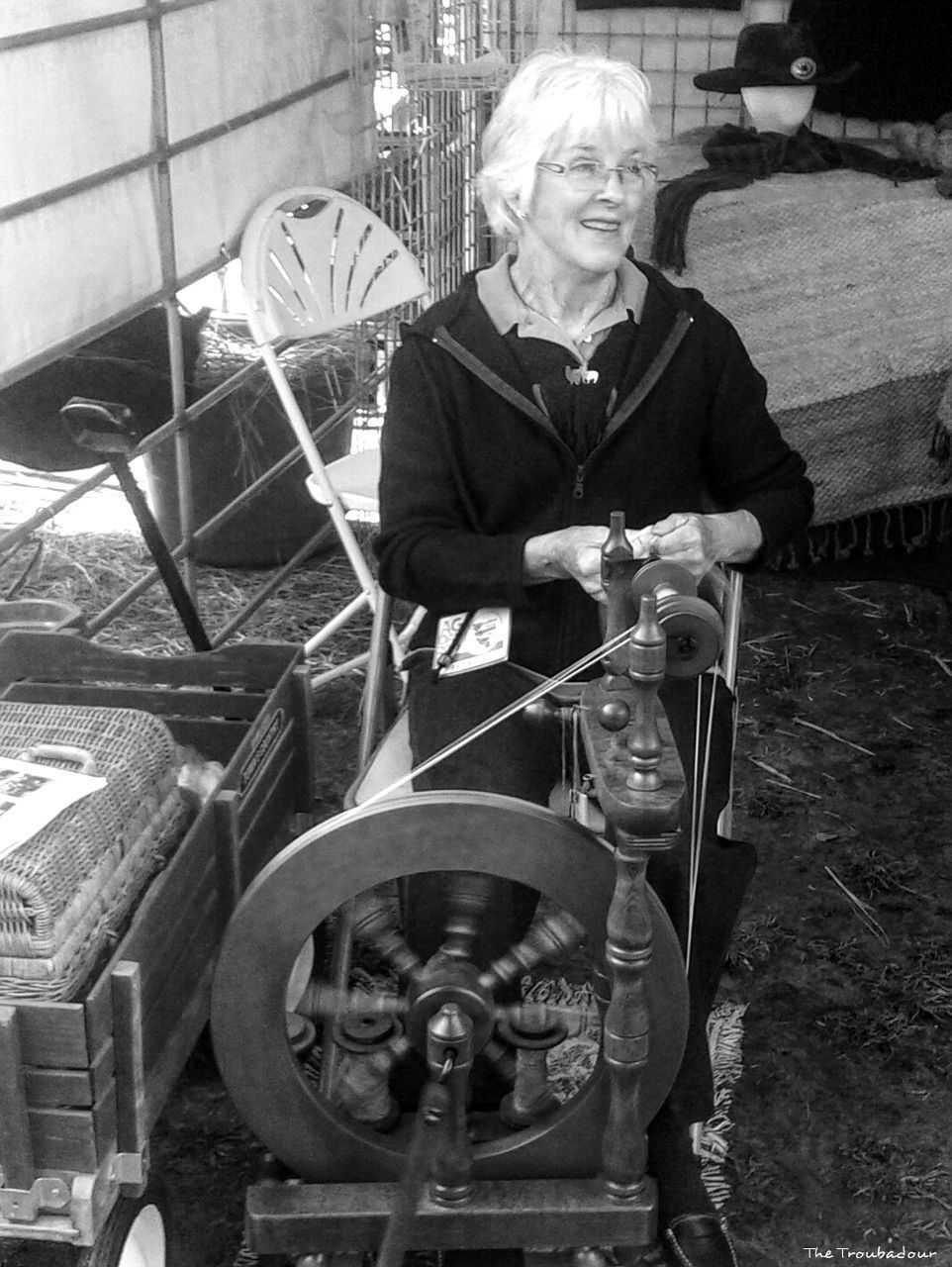 FULL LENGTH PORTRAIT OF WOMAN SITTING ON A OUTDOORS