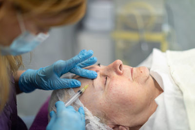 Side view of doctor examining patient