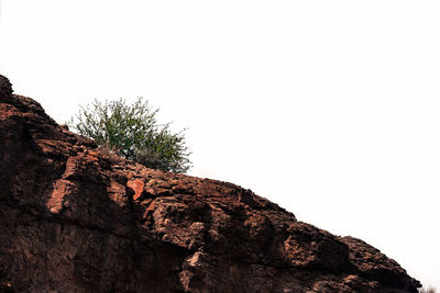 Low angle view of rock formation against sky