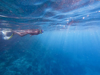 Woman swimming in sea