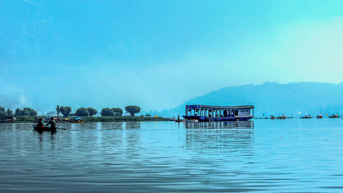 Scenic view of lake against clear blue sky