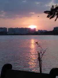 Scenic view of river at sunset