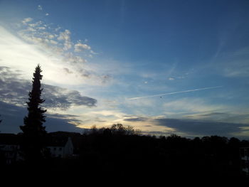 Silhouette of trees against sky at sunset