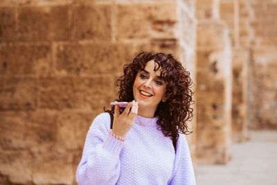 Young woman using mobile phone