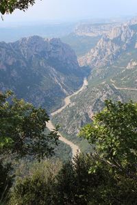 High angle view of valley and mountains against sky