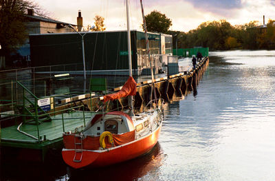 Boat in river against sky