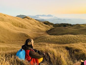 Rear view of man looking at mountains