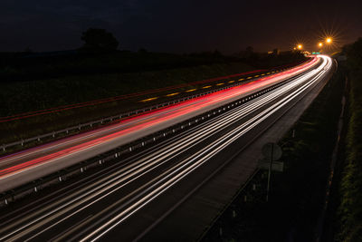 High angle view of light trails on road