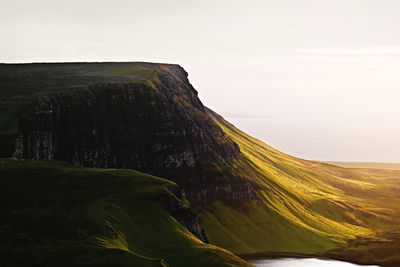 Scenic view of landscape against sky in golden hour.