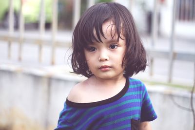 Portrait of cute girl standing outdoors