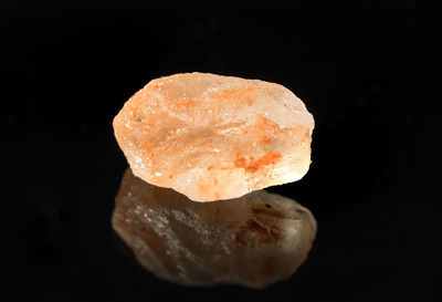 Close-up of ice cream over black background