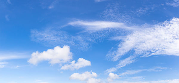 Panoramic fluffy clouds in the blue sky, soft white clouds against blue sky