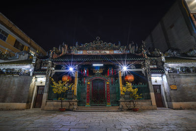 Illuminated entrance of building at night