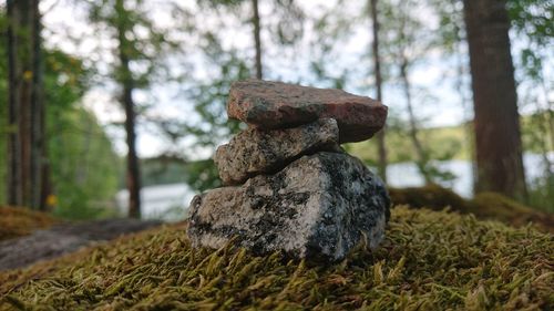 Close-up of stack of rocks on field