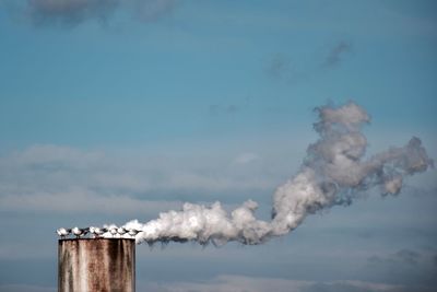 Close-up of smoke stack against sky