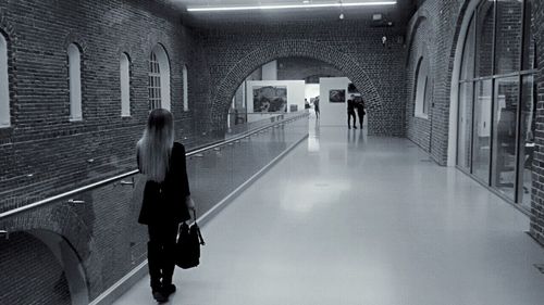 Full length of woman walking in corridor