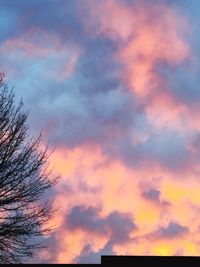 Low angle view of cloudy sky at sunset