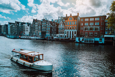 Amsterdam netherlands dancing houses over river amstel landmark