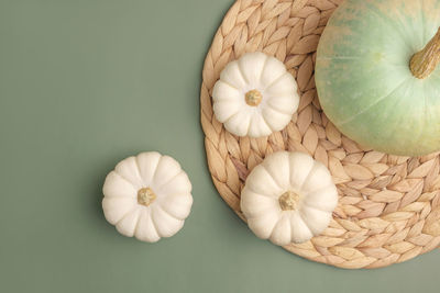 Pumpkins on green. flat lay, top view, copy space. nordicthanksgiving  modern invitation mock up