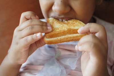 Close-up of woman eating food