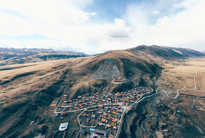 High angle view of snowcapped mountains against sky