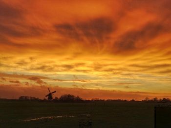 Scenic view of landscape against cloudy sky