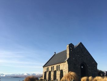 Old building against clear blue sky