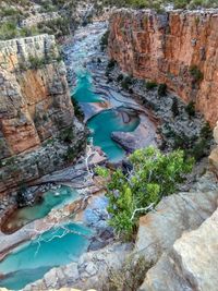 High angle view of river flowing through rocks