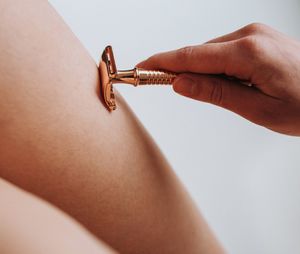Woman body part with safety shaving razor
