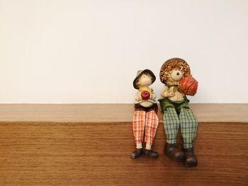 Children playing with ball against white background