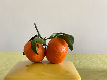 Close-up of orange fruits on table
