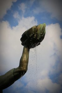 Low angle view of wet plant against sky