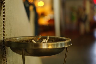 Close-up of drinking glasses on table