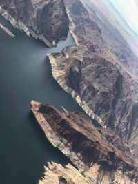 High angle view of rock formations in sea