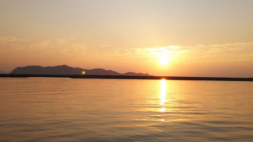 Scenic view of sea at sunset