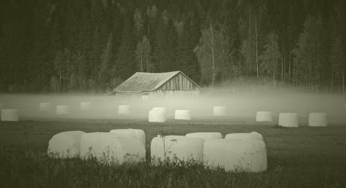 Built structure on field against sky at night