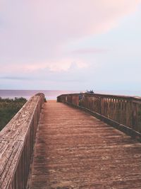 Pier over sea against sky