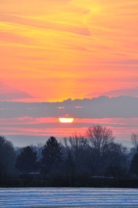 Scenic view of orange sky