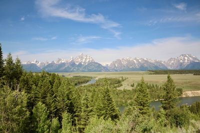 Scenic view of landscape and mountains against sky