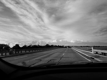 Road against cloudy sky