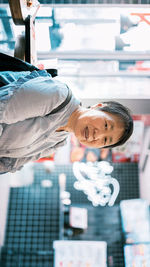 Portrait of man working at bus