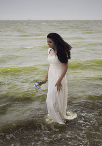 Woman standing at beach